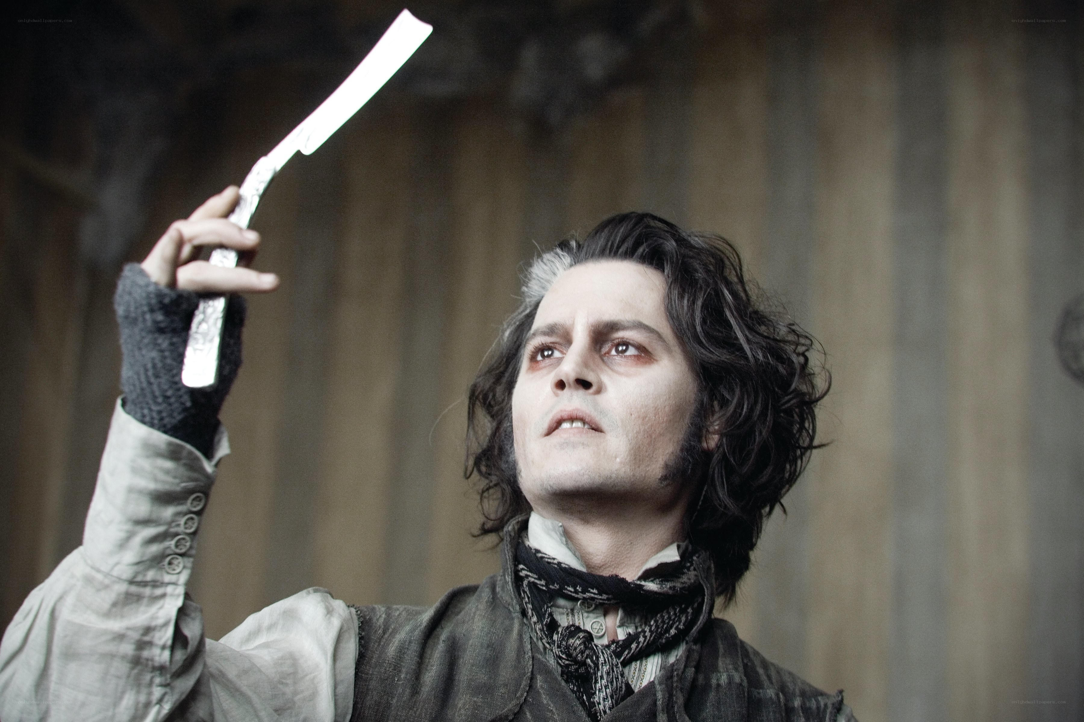 man holding razor blade