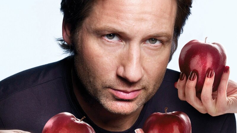 man holding red apples