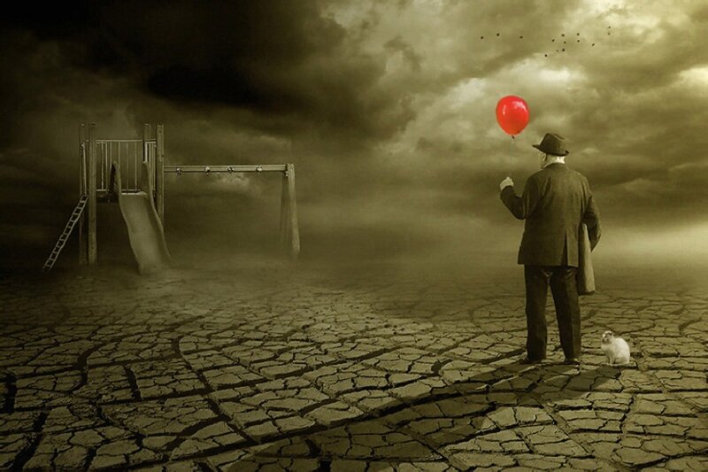 Man Holding Red Balloon