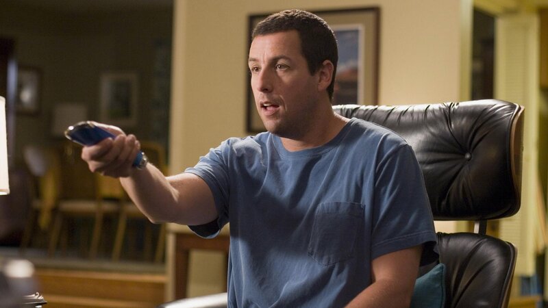 man holding remote control