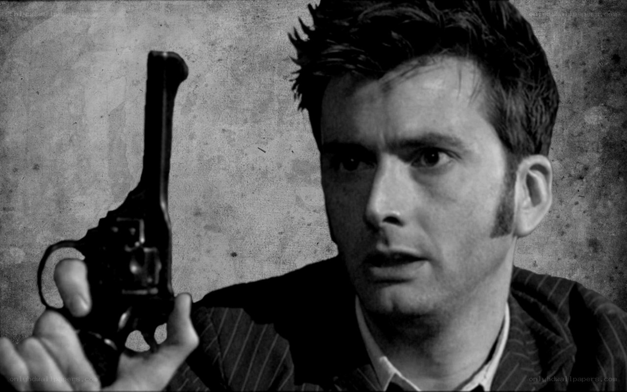 man holding revolver