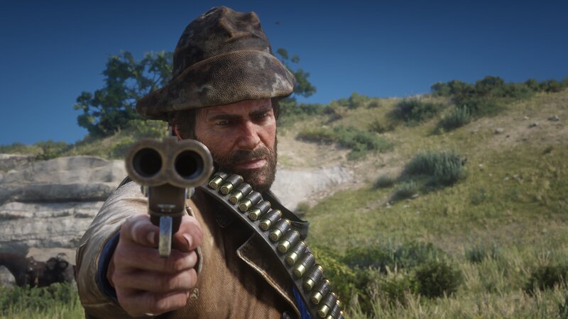 Man Holding Revolver — Brown, Tense