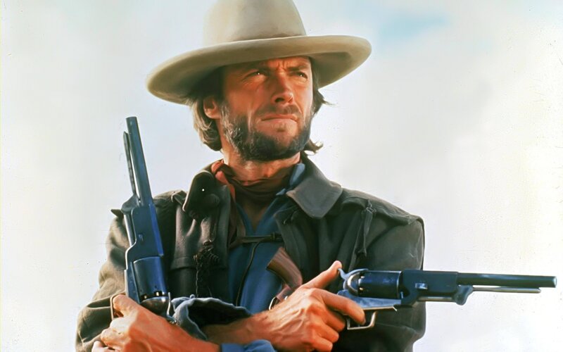 Man Holding Revolvers