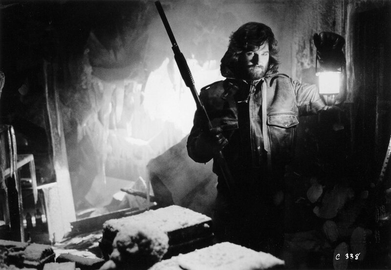 Man Holding Rifle and Lantern