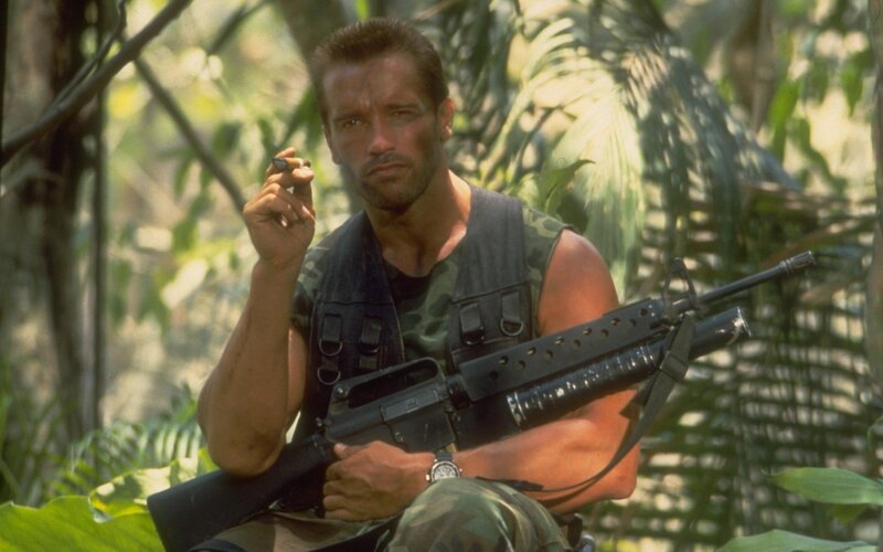 Man Holding Rifle — Green, Serious, Afternoon