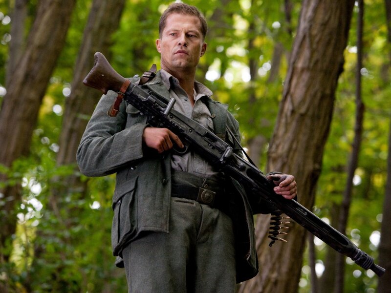 Man Holding Rifle — Green, Serious