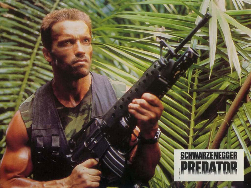 Man Holding Rifle — Green, Tense