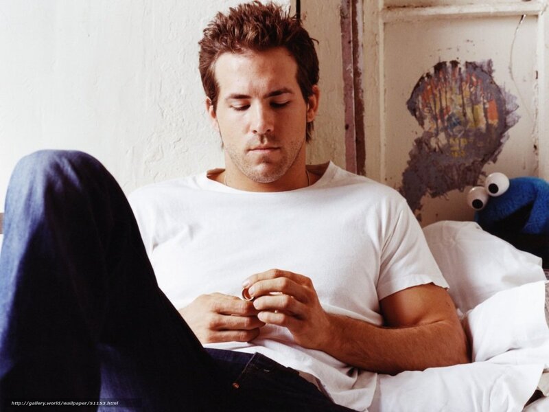 man holding ring on bed