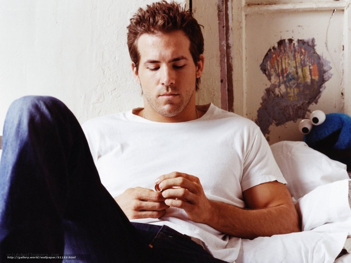 man holding ring on bed