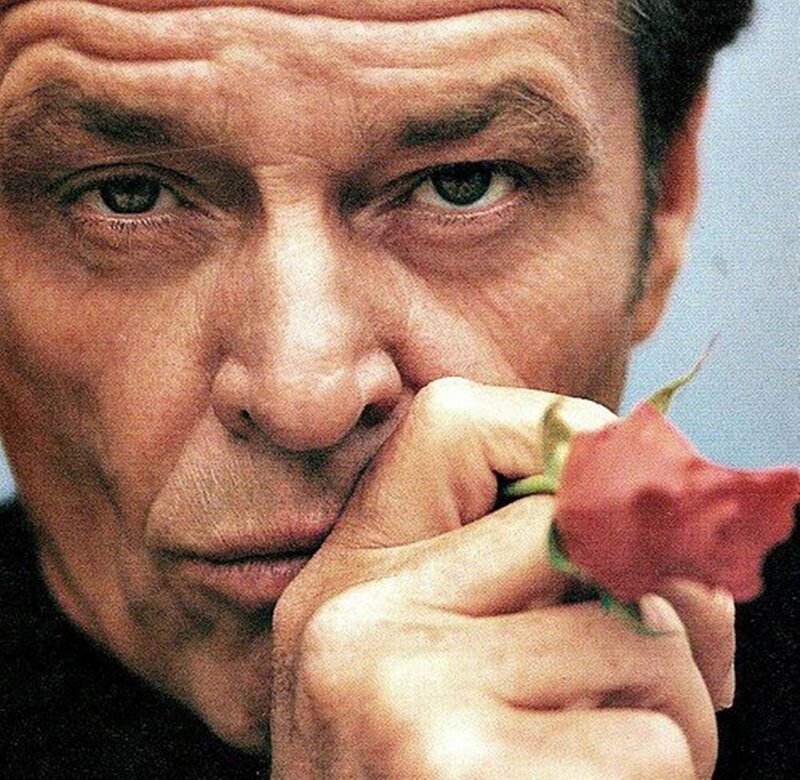 Man Holding Rose — Red, Contemplative