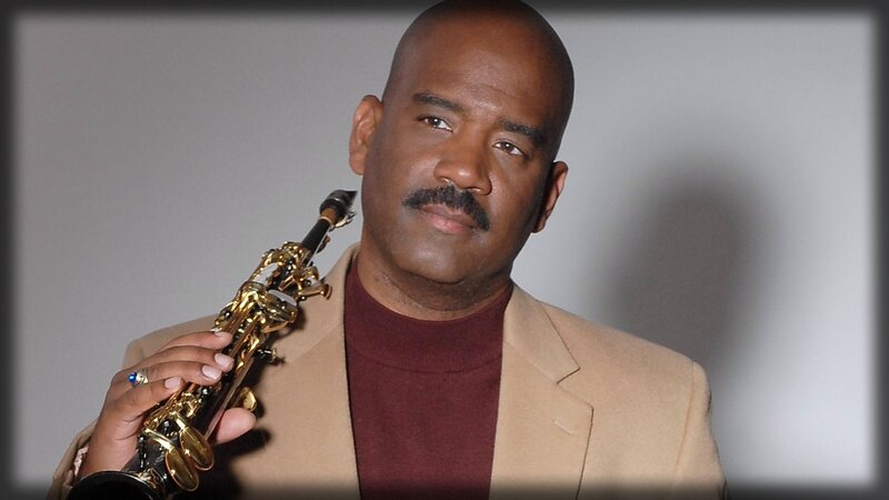 man holding saxophone