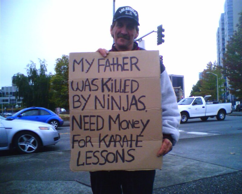 Man holding sign about father killed by ninjas