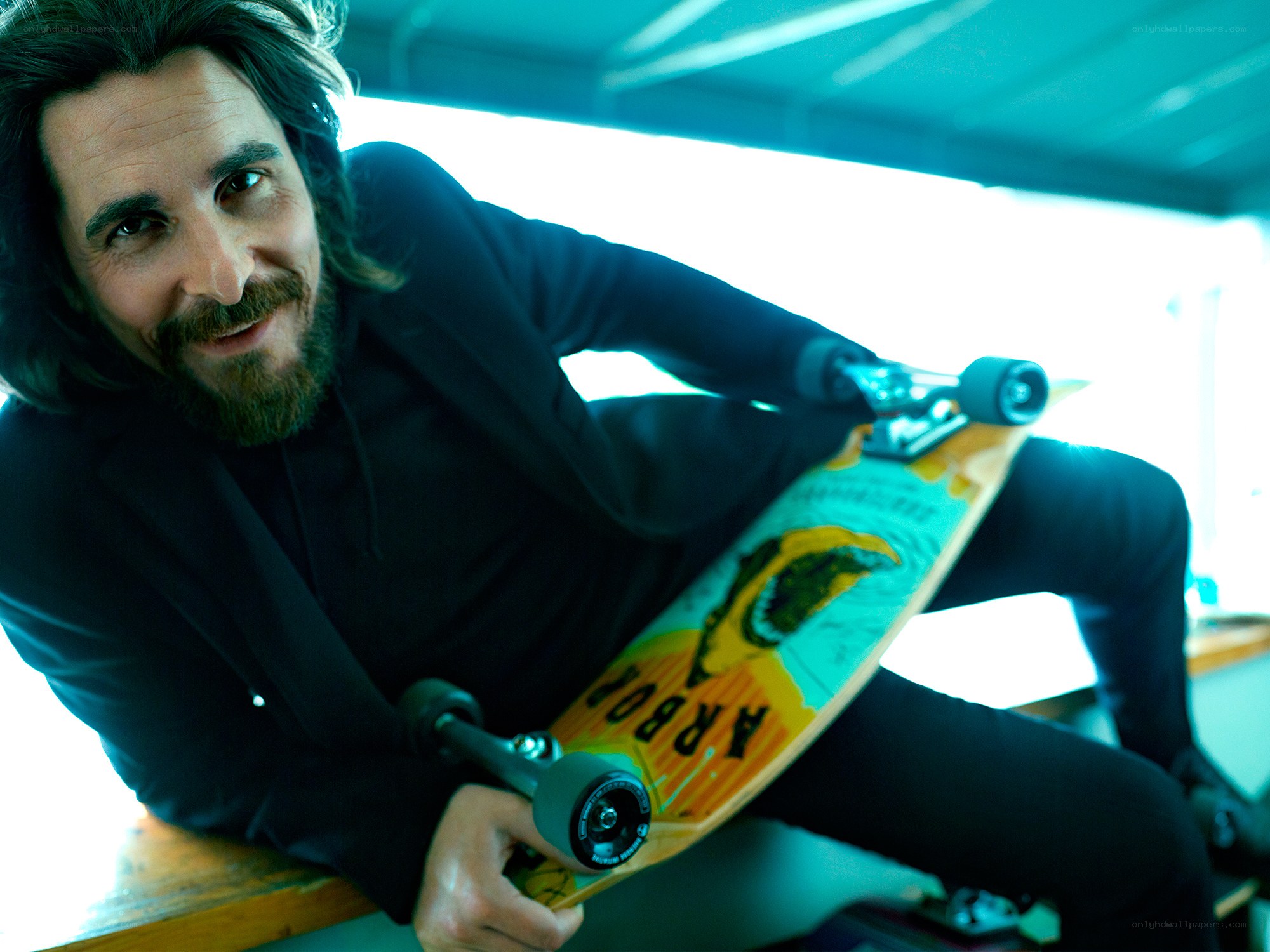 man holding skateboard