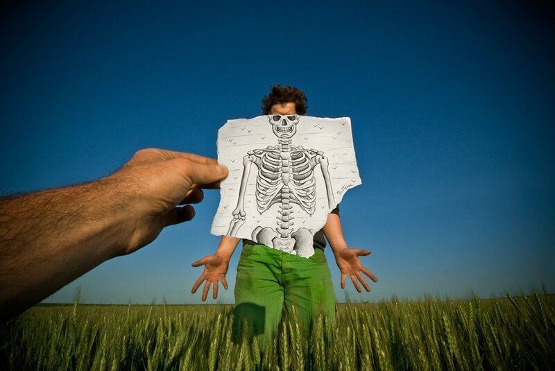 Man Holding Skeleton Drawing