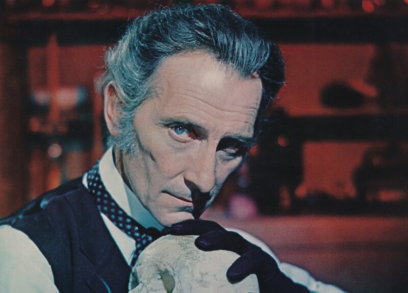 man holding skull in lab