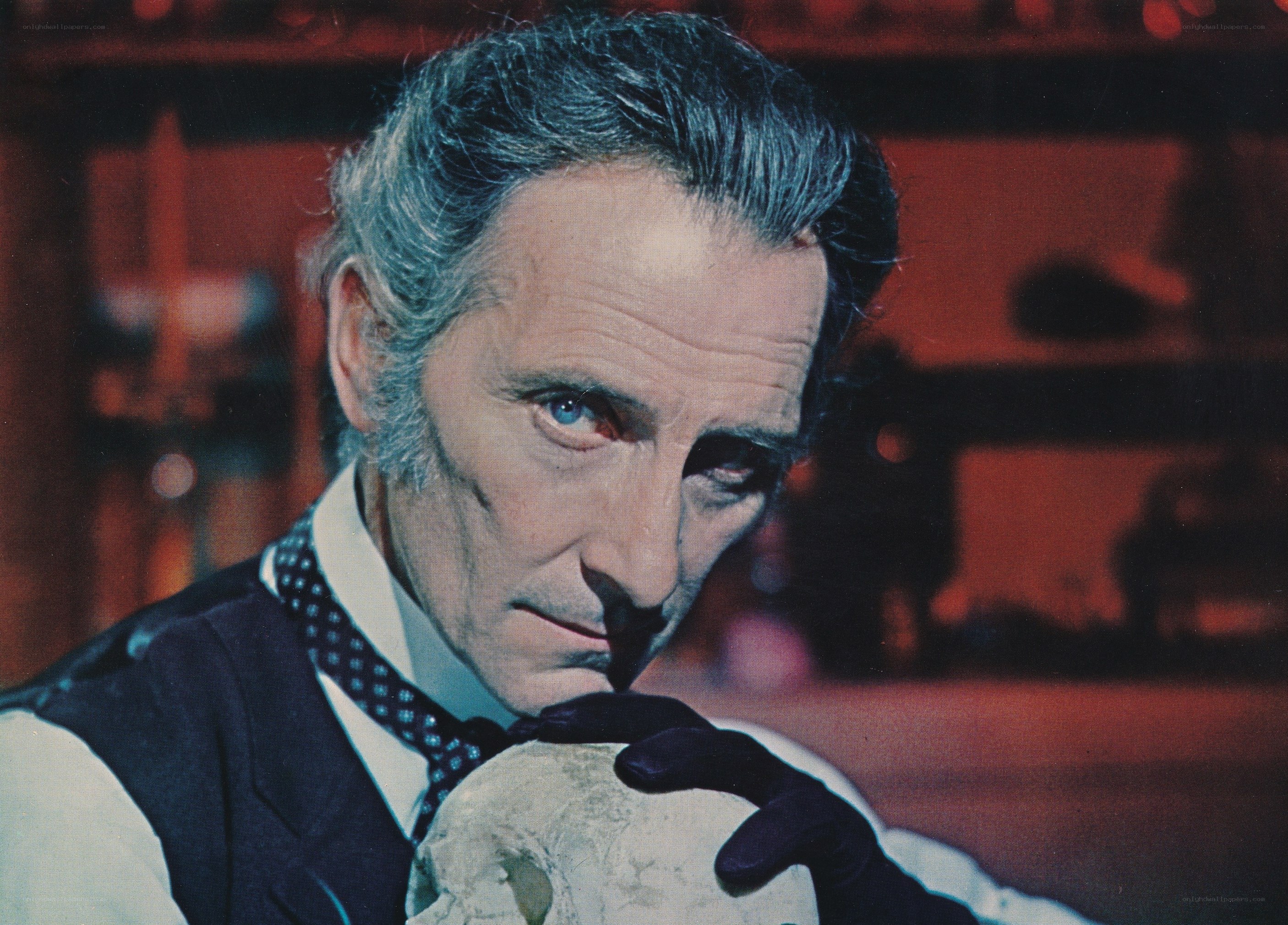 man holding skull in lab