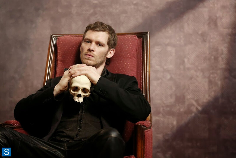 Man Holding Skull — Red