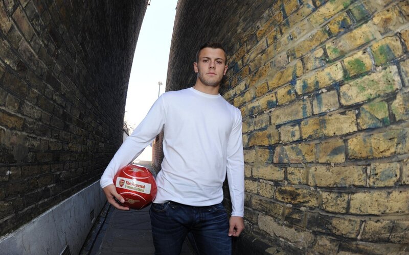 Man Holding Soccer Ball — White