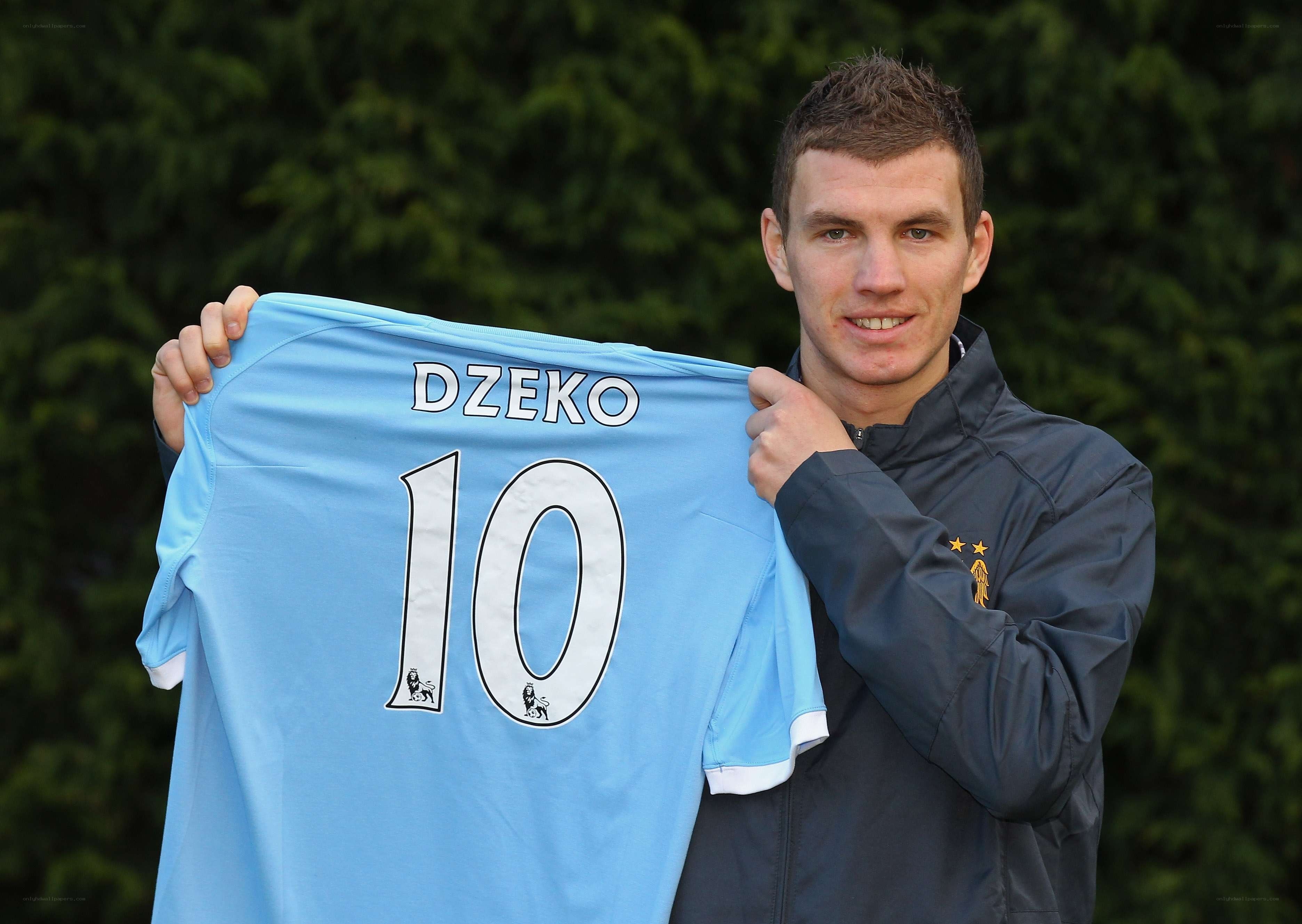 man holding soccer jersey