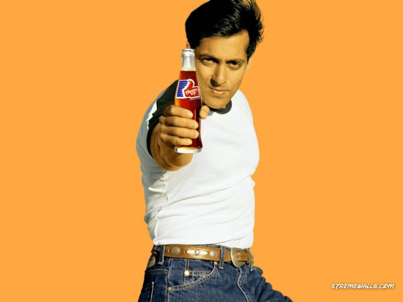 Man Holding Soda Bottle — Orange