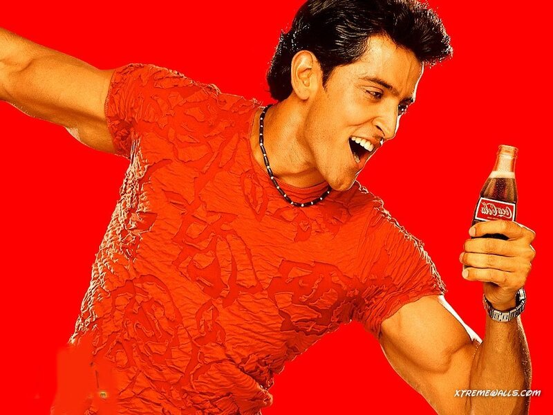 Man Holding Soda Bottle — Red