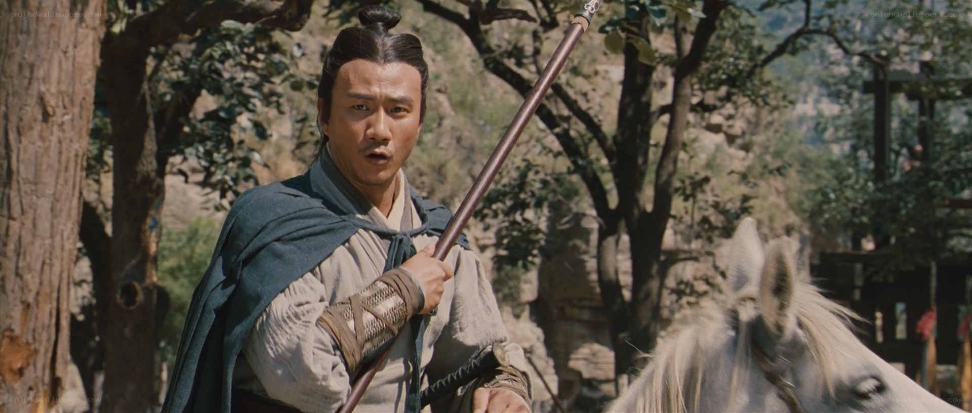 man holding spear on horseback