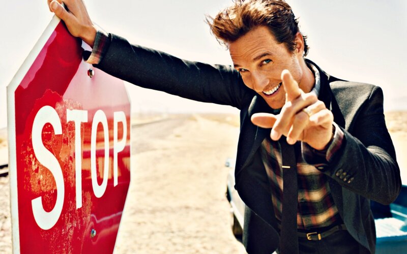 Man Holding Stop Sign
