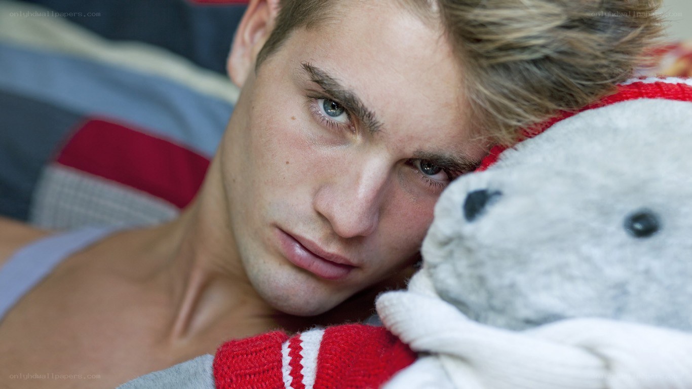 man holding stuffed animal