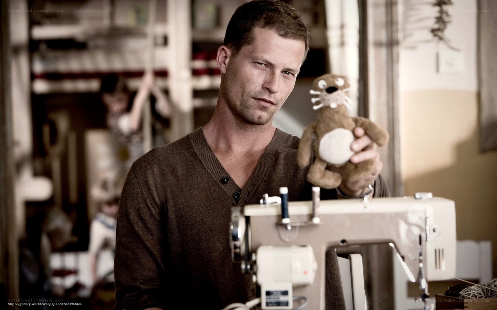 man holding stuffed animal