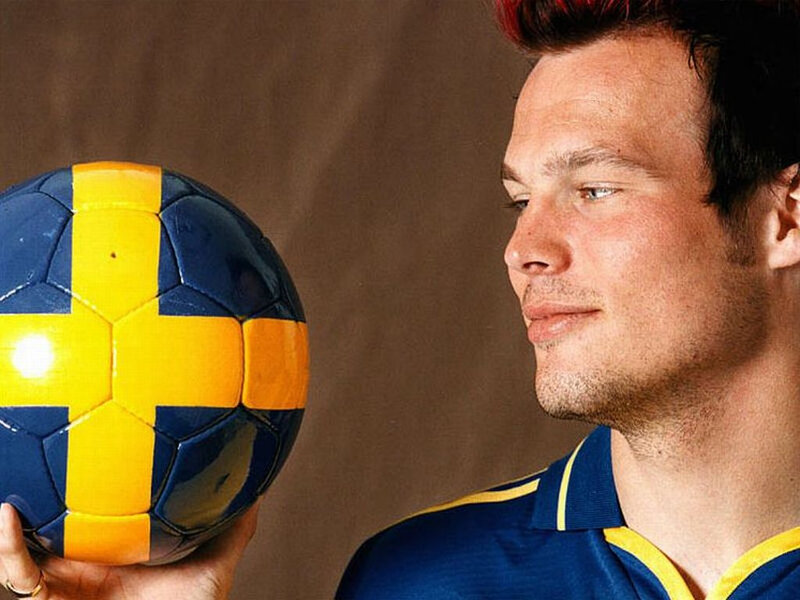 man holding swedish football