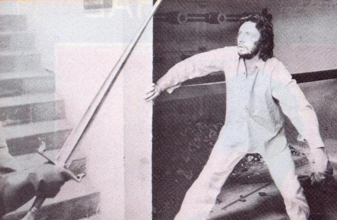 man holding sword on stairs