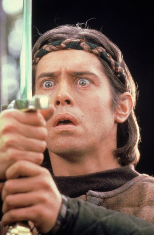 man holding sword with shocked expression