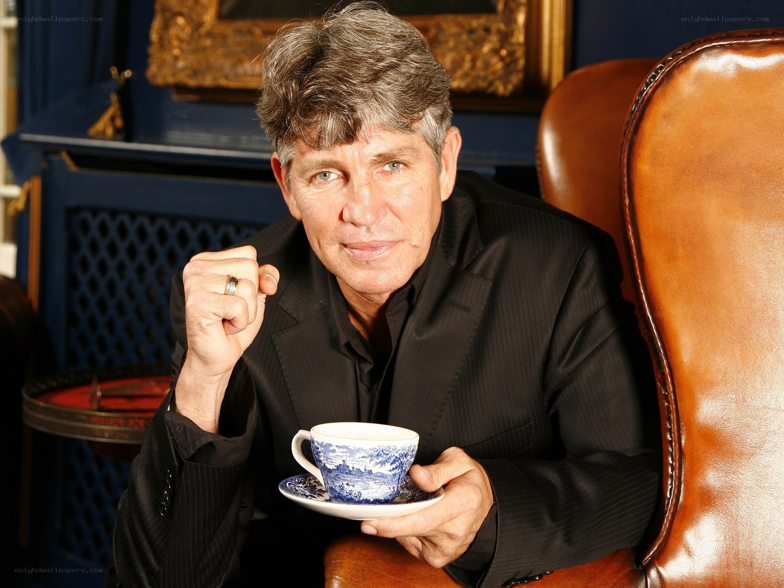 man holding tea cup