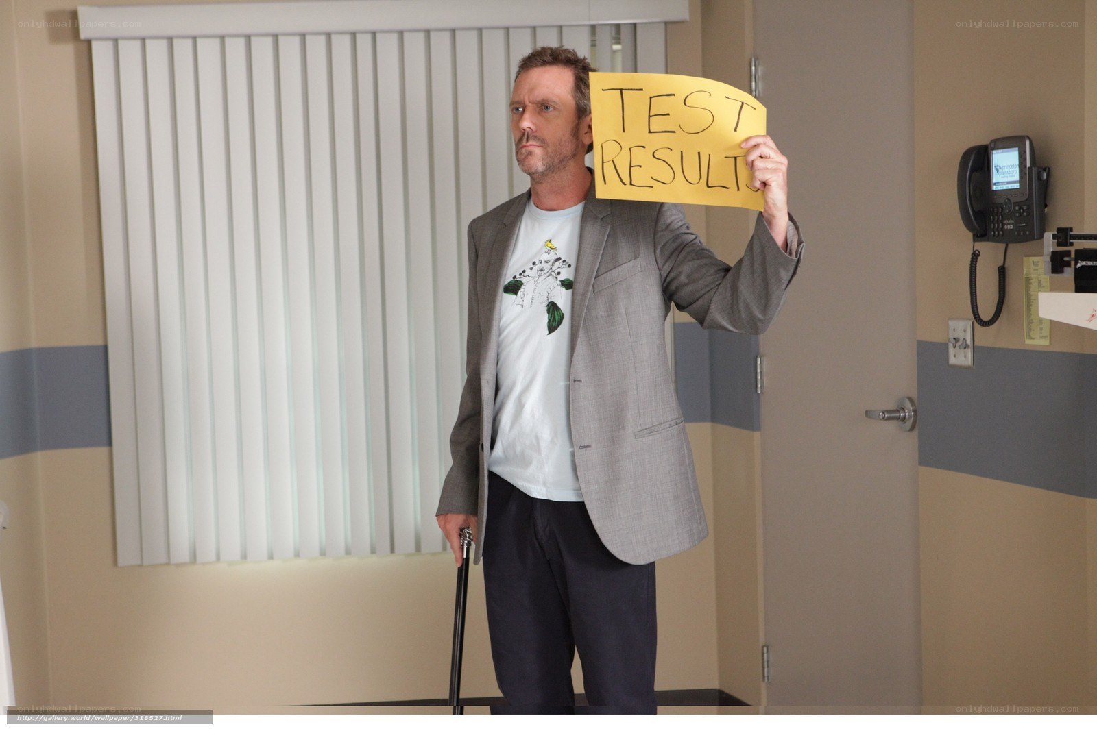 man holding test results sign