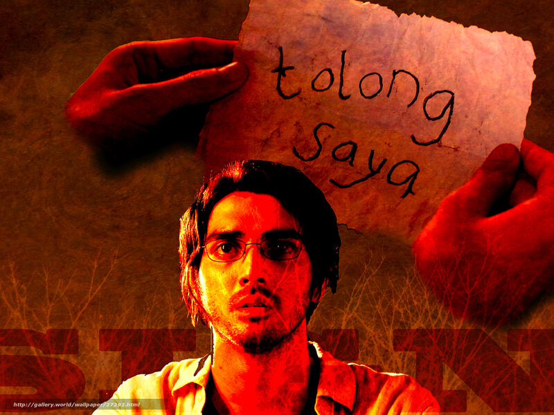 Man holding 'tolong saya' sign
