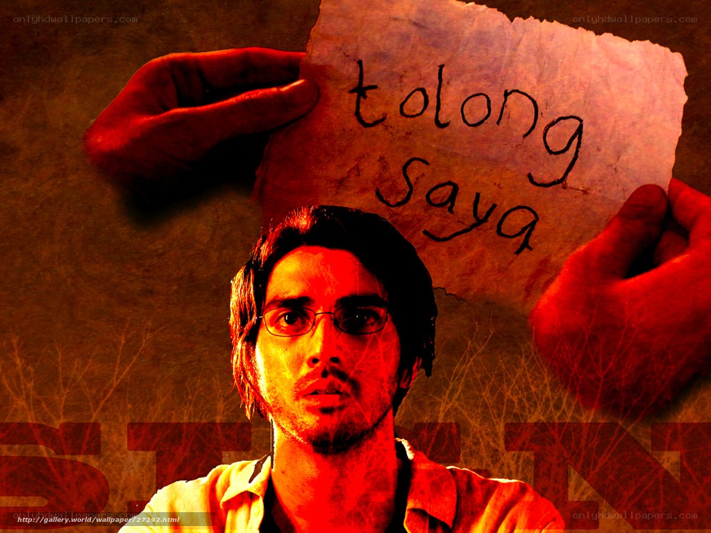 Man holding 'tolong saya' sign