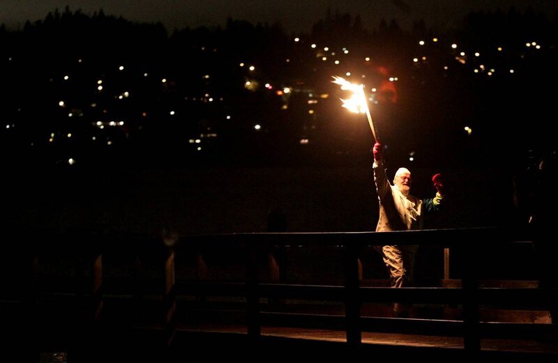 Man holding torch at night