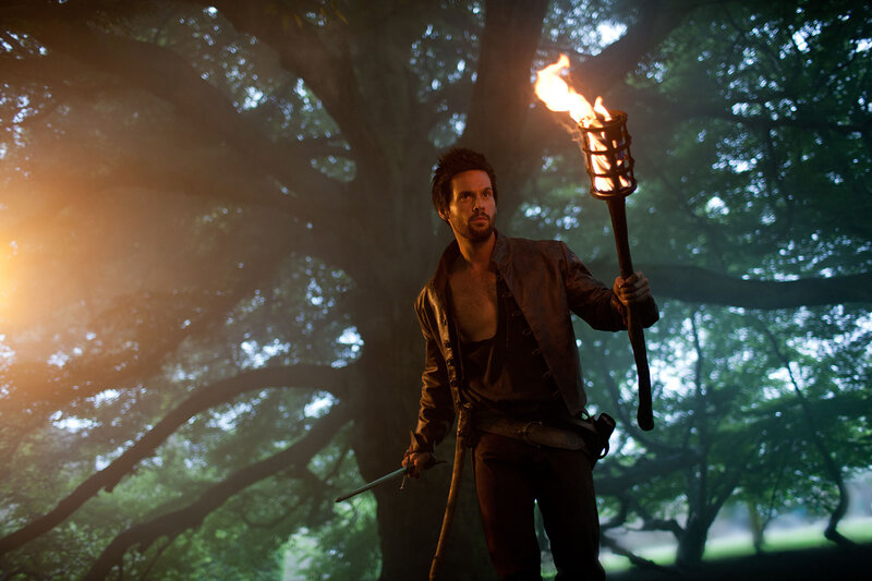 Man Holding Torch — Brown