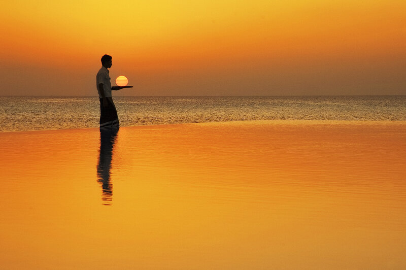 Man Holding Tray in Water