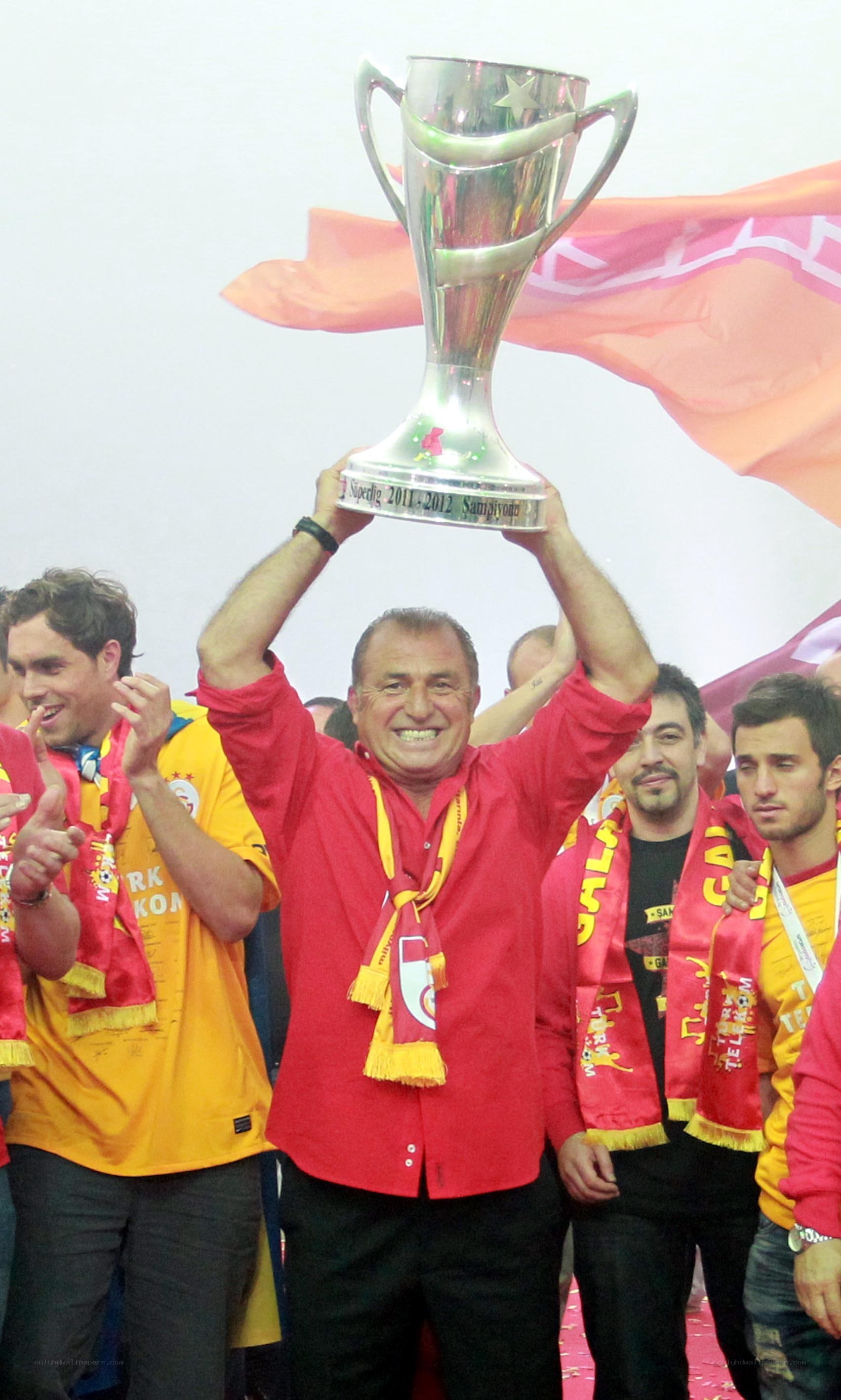 Man holding trophy at celebration
