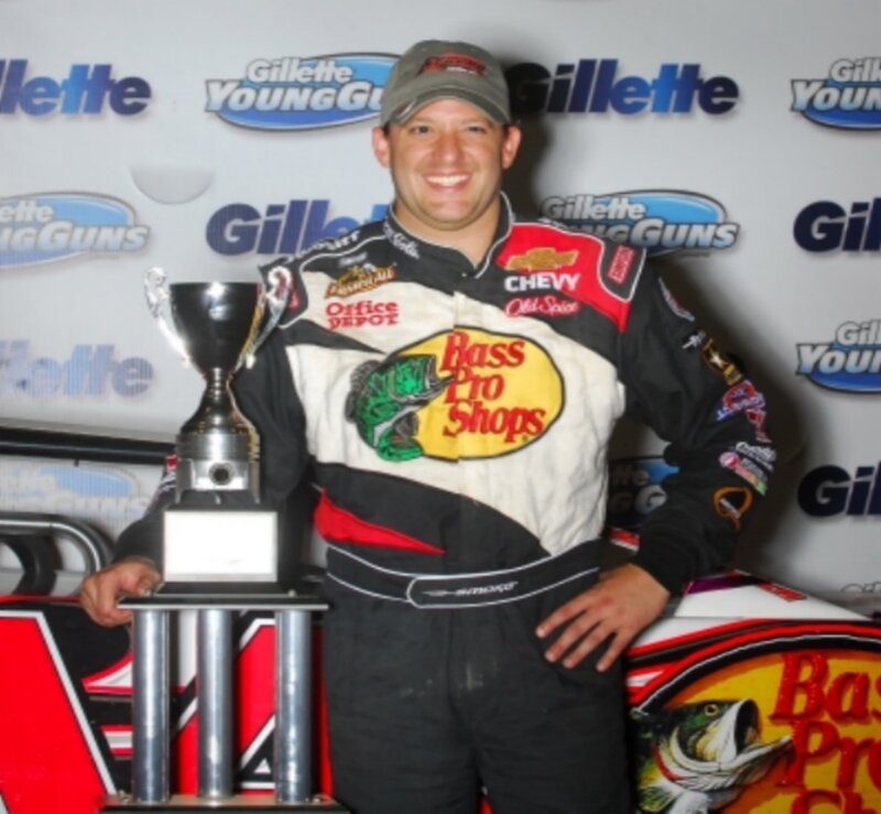 man holding trophy at event