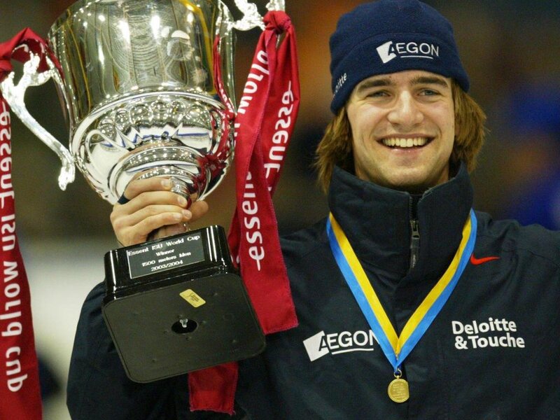Man Holding Trophy — Blue, Celebratory, Photograph