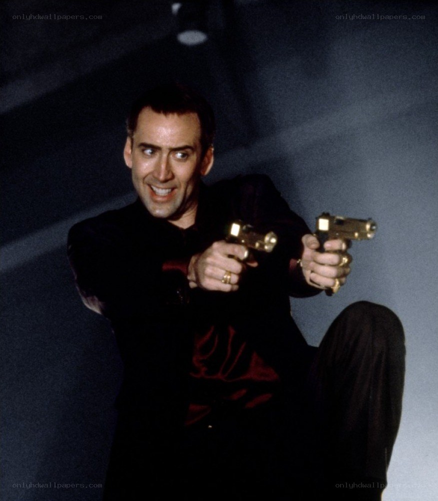 Man holding two golden guns