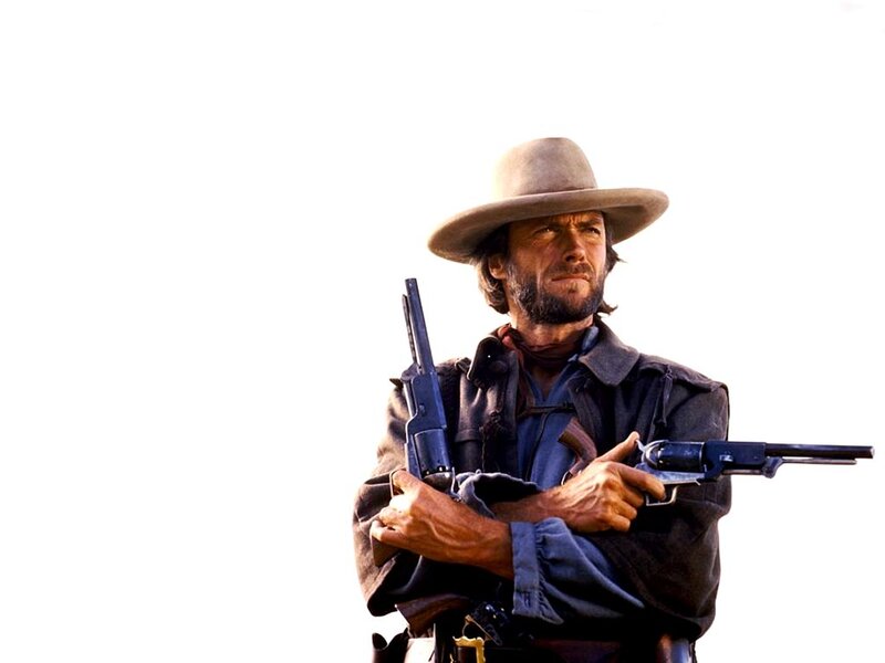 Man Holding Two Guns — Brown, Dramatic, Photograph