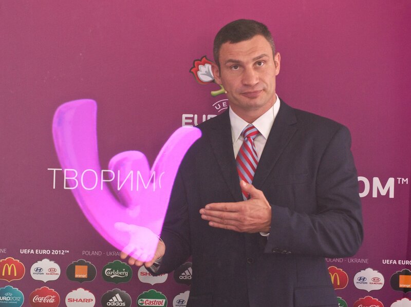 Man holding UEFA Euro trophy