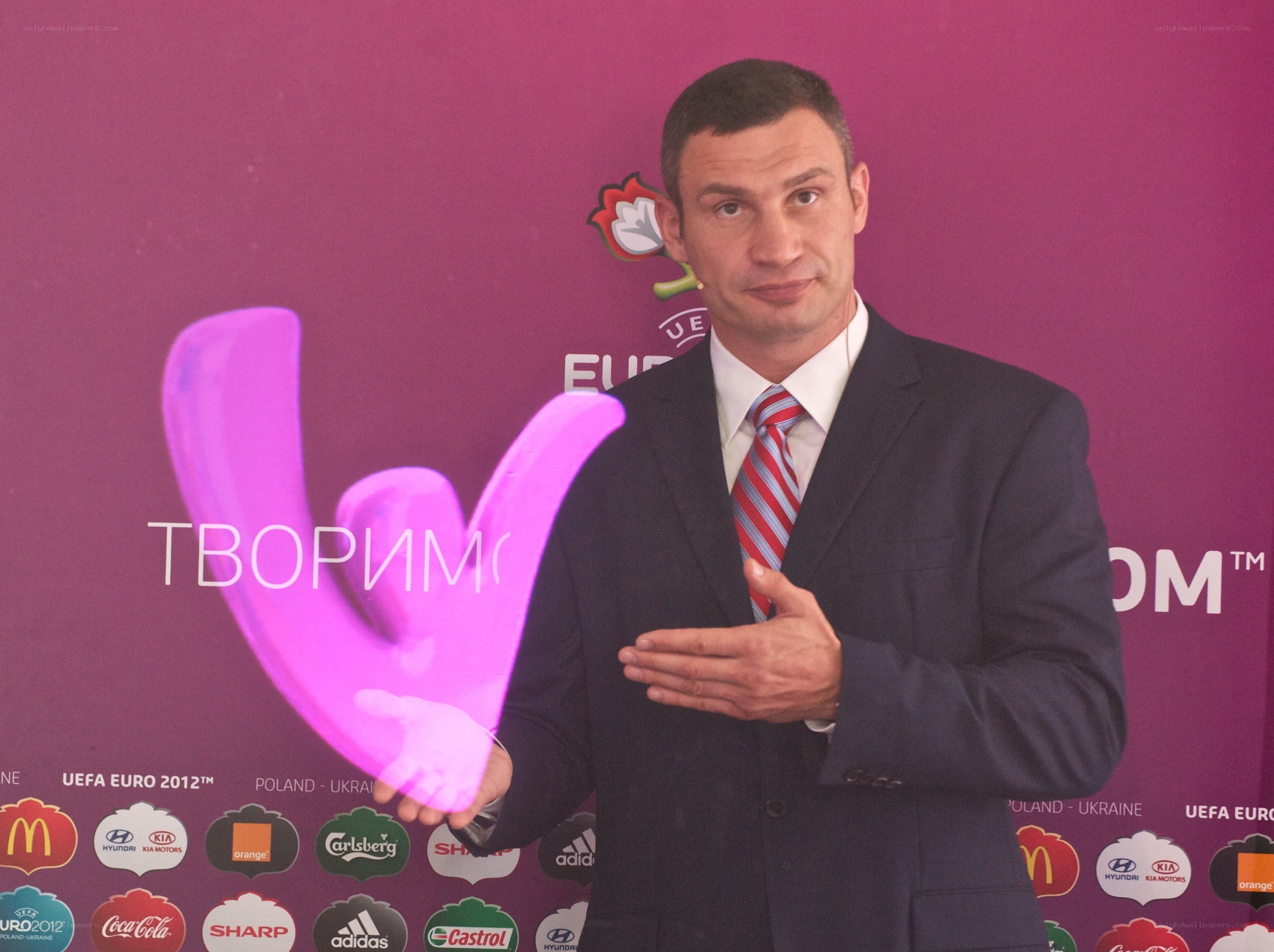 Man holding UEFA Euro trophy