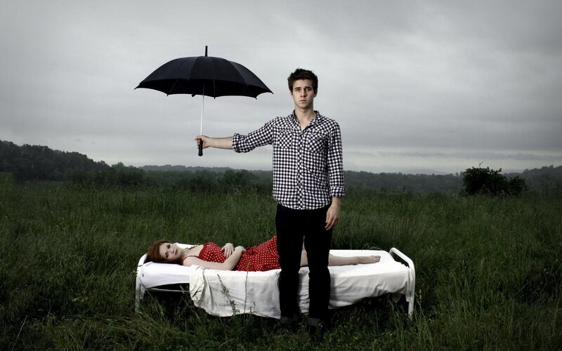 Man Holding Umbrella — Green