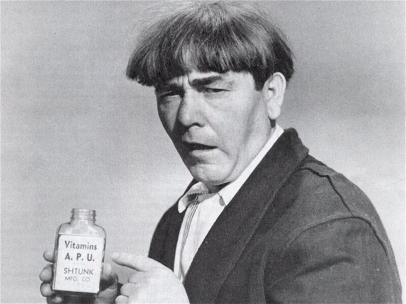 Man holding vitamin bottle