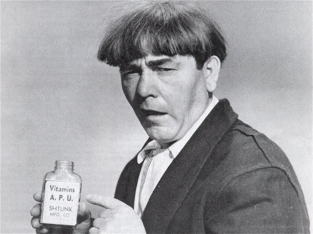 Man holding vitamin bottle
