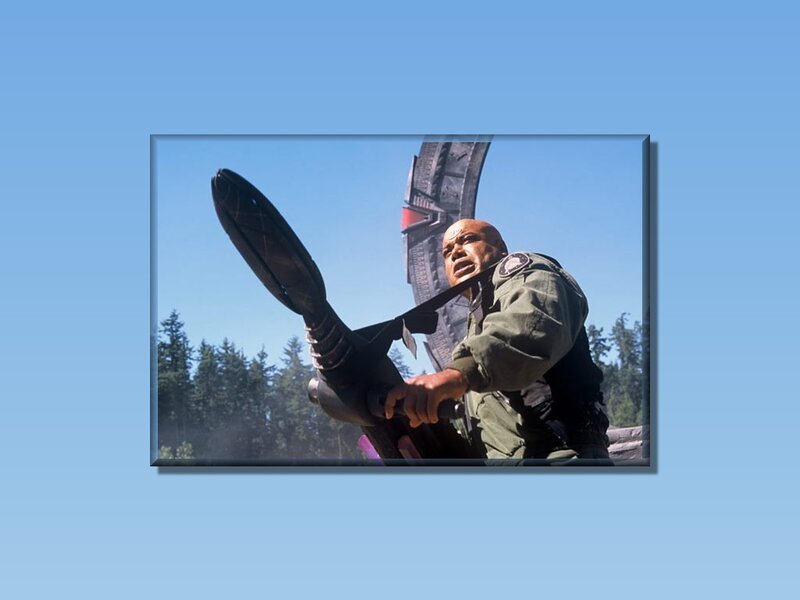 man holding weapon in forest